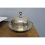 A silver muffin dish and cover, of circular form, with turned wooden knop, London 1911, weight 21oz