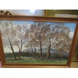 An oil on artist board, view through trees of the Malvern Hills, initialled, 20ins x 30ins