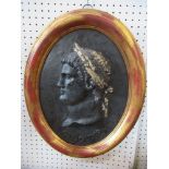 An oval relief picture, of a Classical bust, in black with gold highlights, Otho Imp, maximum