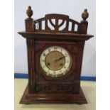 An oak cased Edwardian mantle clock