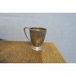 A silver mug, raised on a stepped circular foot, Birmingham 1953, weight 2oz
