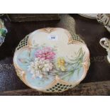 A Royal Worcester plate, with part pierced border, decorated with flowers, diameter 8.75ins