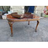A Georgian design mahogany extending dining table, raised on claw and ball feet, height 30.5ins x