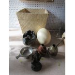An ostrich egg, together with a stone egg and other items