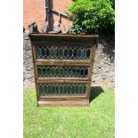 An oak three sectioned bookcase, with adjustable shelves, width 29ins, height 42ins, depth 9ins