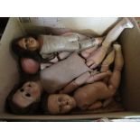 A box of dolls, together with a box of thimbles