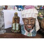 A novelty porcelain tobacco jar, formed as seated figure with his head in his hands, height 8.5ins