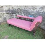 A Victorian style chaise longue, raised on turned legs, length 73ins x depth 27.5ins x max height