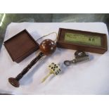 A 19th century miniature set of bone skittles, ball and dice in a mahogany box, together with