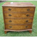 A serpentine fronted chest, of four graduated drawers, width 30ins x depth 18.5ins x height 33ins