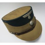 A WW2 style German army kepi, in tan cotton fabric, with an emerald green felt top and silver button