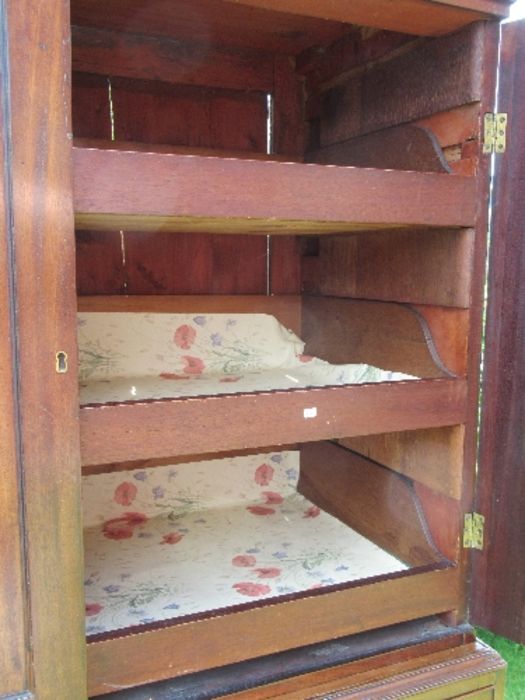 A 19th century mahogany press cupboard, having two panel doors opening to reveal three slide out - Image 2 of 6