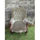A Victorian chair, in green upholstery