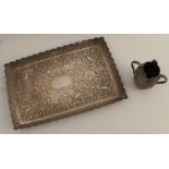 An Oomersi Mawji Indian silver tray, of rectangular form, heavily decorated with birds, leaves and