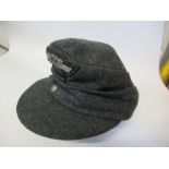 A German Third Reich style M43 field cap, in grey wool, with appliqued NSKK RMBO motif to the