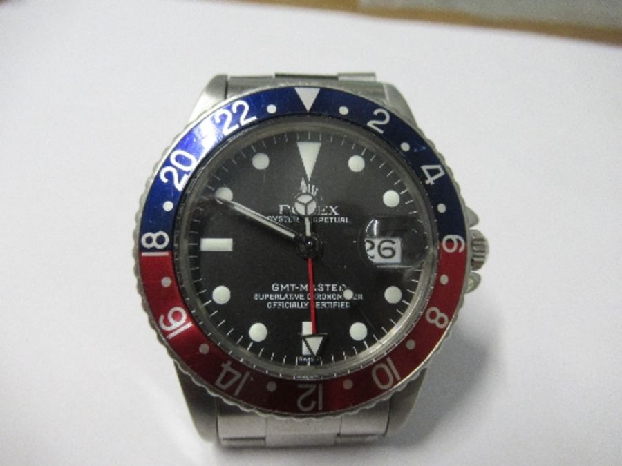 A 1970 Rolex GMT Master wristwatch, Model No. 1675, having wide "Pepsi" Bezel, and pointed crown - Image 7 of 12