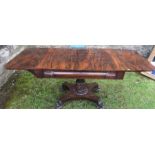 A 19th century rosewood sofa table raised on a platform base