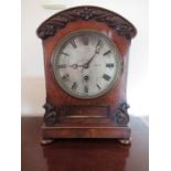 A 19th century mahogany bracket clock, the circular silvered dial below a domed top hood, and raised