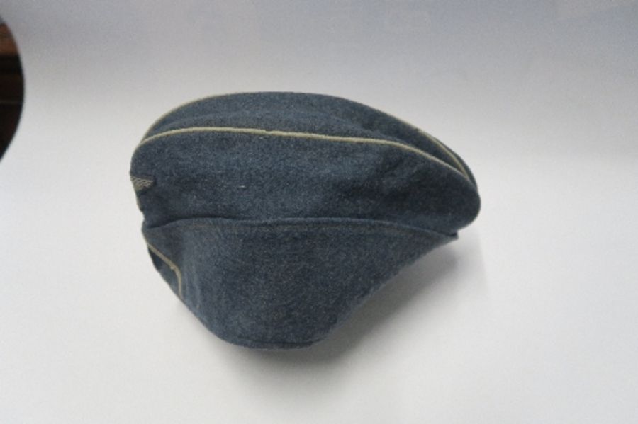 A Third Reich style M38 side hat, in grey wool fabric, having appliqued white RMBO motif to the - Image 12 of 19