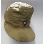 A WW2 Afrika Korps style M41desert field cap, with red interior, headband worn, together with a