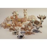 Fourteen Szeiler models, of donkeys, cows and horses, various sizes and colours, some af