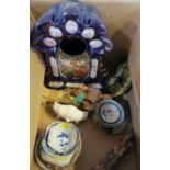 A mixed box of china, etc, to include a Continental porcelain clock case, a carved soapstone figure,