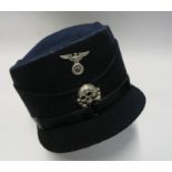 A 1932-33 SS style Pillbox Cap, in black, bearing silver coloured metal RMBO eagle and Hussar skull,