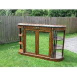 A Victorian credenza, possibly burr walnut or thuya, having two central mirrored doors, with open