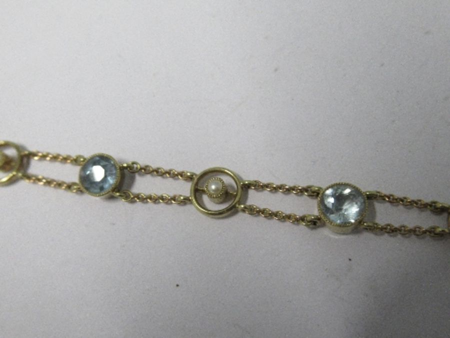 An Edwardian aquamarine and seed pearl bracelet, the six round cut aquamarines alternate set with - Image 3 of 3