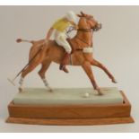 A Royal Worcester figure, The Polo Player, modelled by Doris Lindner, model number 3163, with plinth
