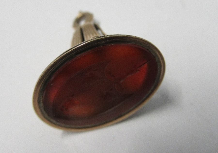 An early 19th century seal fob, set with a carnelian engraved with an armorial