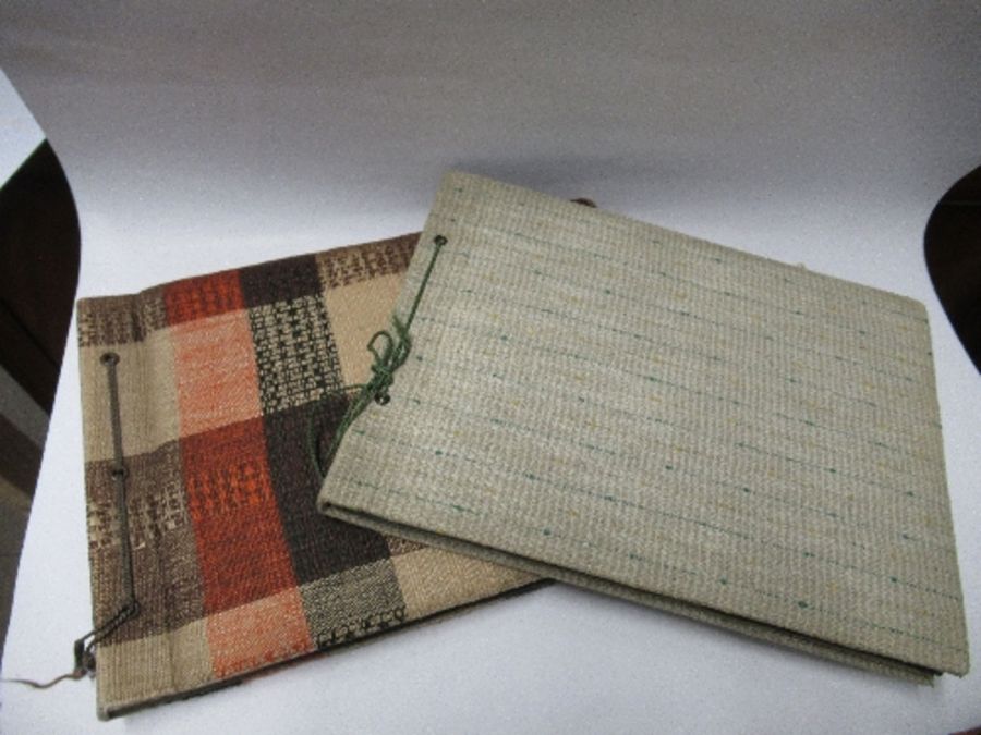 Two photograph albums, the inside front cover of one with World War 2 death notices for Karl