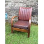 An Art Deco leather open armchair