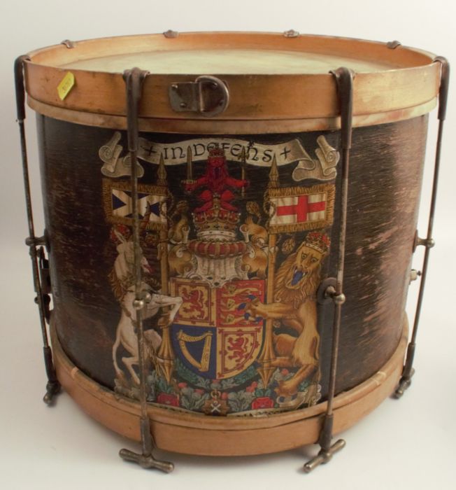 A wooden drum, painted with a coat of arms, diameter 16ins, height 13.75ins