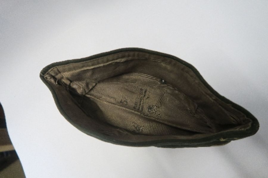 A Third Reich style M38 side hat, in grey wool fabric, having appliqued white RMBO motif to the - Image 3 of 19