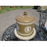 A  Wedgwood style brown basalt stilton cover and stand, decorated all around with panels of
