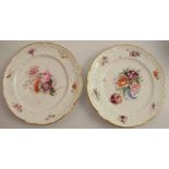 Two 19th century Nantgarw plates, decorated with floral sprays to a moulded shaped edge, stamped