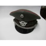 A Third Reich style policeman's visor cap, in grey wool with red piping and silver coloured braid,