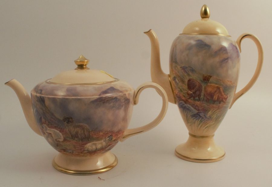 F Clark, a porcelain tea pot, decorated with Sheep in landscape to the front, height 7ins,