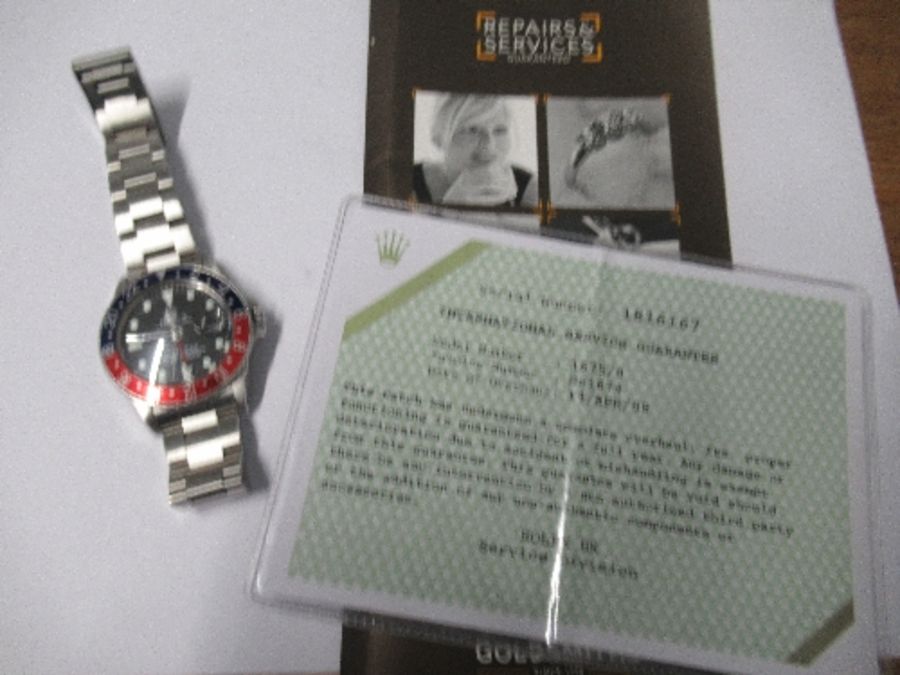 A 1970 Rolex GMT Master wristwatch, Model No. 1675, having wide "Pepsi" Bezel, and pointed crown