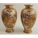 A pair of Satsuma vases, decorated with panels of figures, seal marks to base, height 10ins