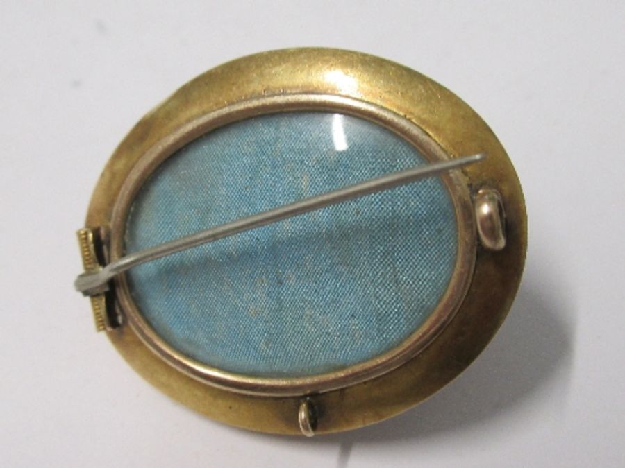 A Victorian oval brooch, unmarked, with locket back, 3.9cm long, 11g gross - Image 2 of 2