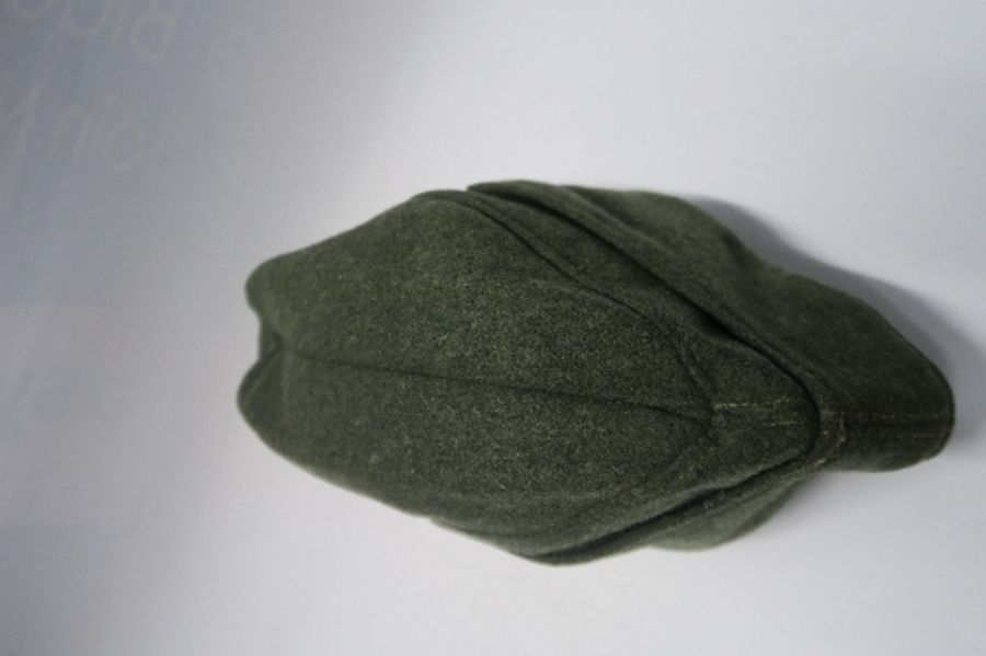 A Third Reich style M38 side hat, in grey wool fabric, having appliqued white RMBO motif to the - Image 7 of 19