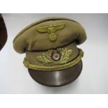 A Third Reich style Gauleiter's visor cap, in light brown cotton with matching hat band and black