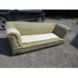 A Chesterfield sofa, with roll ends and raised on short inverted legs, no cushions, width 88ins x