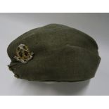 A WW2 style British khaki side hat, bearing Middlesex Regiment cap badge, the cotton interior