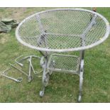 A metal garden table, diameter 35ins, height 36ins, together with an anchor, a lock key and other