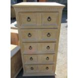 A chest of drawers, with fielded panels, width 25ins x height 49.5ins x depth 24ins