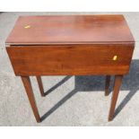 A 19th century mahogany side table/desk, fitted with a drop flap, raised on square tapering legs,