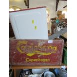 A Carlsberg crate and an enamel bread bin